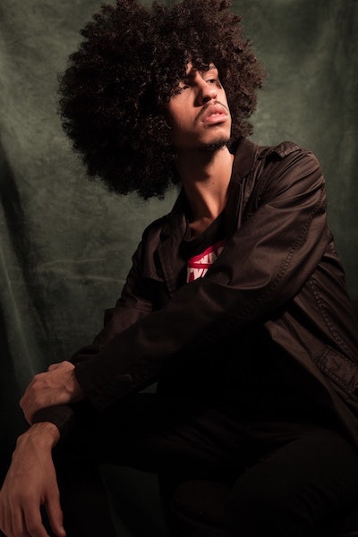 a man with a afro haircut