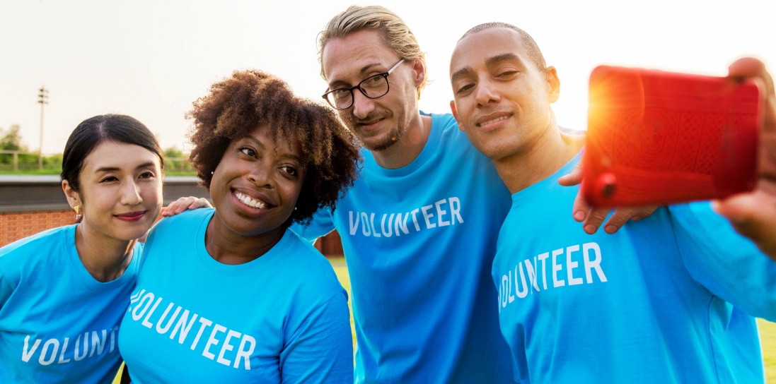 Volunteers smiling at the camera